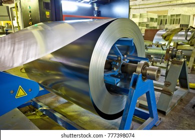 Roll Of Galvanized Steel Sheet For Manufacturing Metal Pipes And Tubes In The Factory.