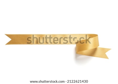 A roll gold ribbon isolated on white background