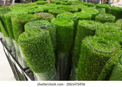 Roll of green artificial grass, shallow DOF, selective focus - Shutterstock ID 2061476936