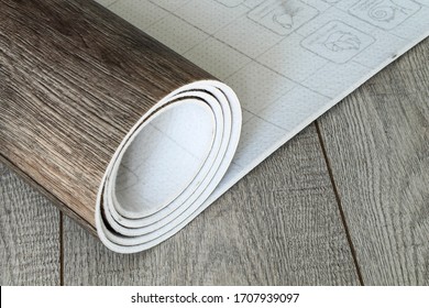 Roll Of Linoleum With A Wood Texture. Types Of Floor Coverings. 