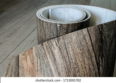 Roll Of Linoleum With A Wood Texture. Types Of Floor Coverings. 