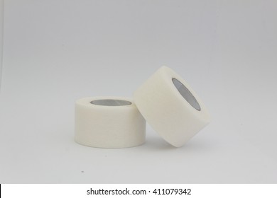 Roll Of Medical Sticking Plaster Or Surgical Tape Isolated Over White Background