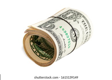 A Roll Of Money Tightened By An Elastic Band On A White Isolated Background. Usd Money Wad, Bundle Of Usa Cash. Top View Of Several American Dollar Bills Rolled And Tied Up.