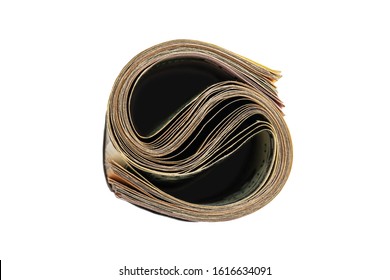 A Roll Of Money Tightened By An Elastic Band On A White Isolated Background. Usd Money Wad, Bundle Of Usa Cash. Top View Of Several American Dollar Bills Rolled And Tied Up.