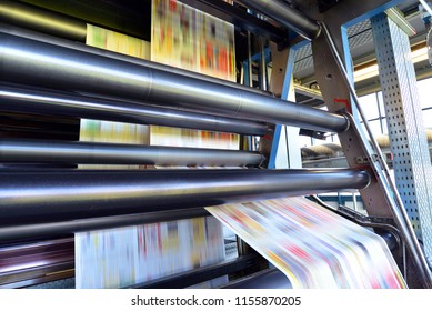 roll offset print machine in a large print shop for production of newspapers & magazines  - Shutterstock ID 1155870205