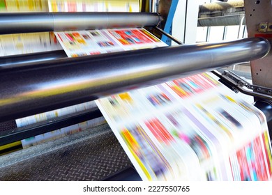 roll offset print machine in a large print shop for production of newspapers and magazines - Shutterstock ID 2227550765