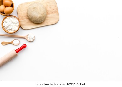 Roll Out The Dough. Dough Ball Near Roller Pin And Other Cookware On White Background Top View Copy Space