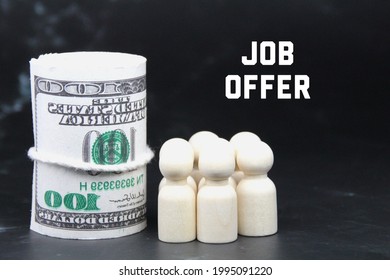 A Roll Of Paper Money, A Peg Doll And The Word Job Offer