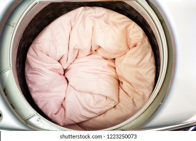 Roll Up The Pink Duvet Put In A Washing Machine.