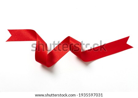 A roll red ribbon isolated on white background