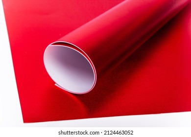 Roll Of Red Shiny Paper For Creativity. Isolon For Flowers. Soft Material For Handmade