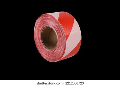 A Roll Of Red-white Ribbon For Fencing, Close-up On Black Background