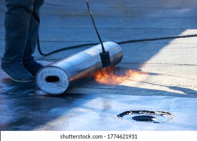 Roll Of Roofing Material With A Gas Burner