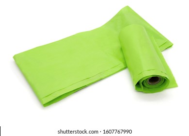 Roll of small plastic garbage bags or environmentally friendly poop bags. Isolated on white. 