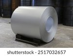 Roll of steel sheet in a plant. Coils of steel stripes in store. steel coils in warehouse, heavy industries. rolls of steel sheet in a plant, galvanized coil.