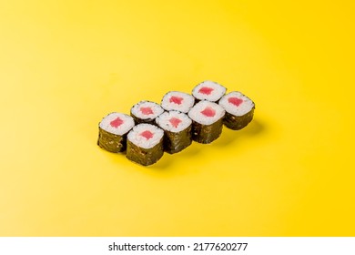 Roll Tuna Maki With Rice On Yellow Background