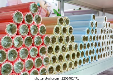 A Roll Of Wrapping Paper On A Shelf In A Store.