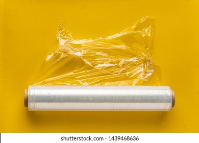 roll of wrapping stretch film for packing at colorful background isolated 