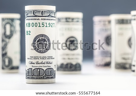 Rolled american dollars banknotes in vertical position.