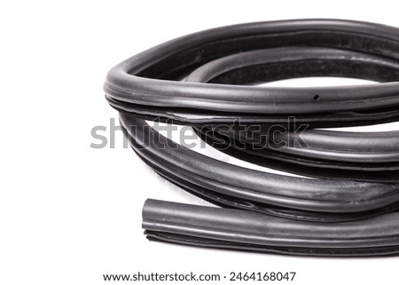 Rolled up black rubber sealant for elements of the car body, doors or trunk, for noise insulation, thermal and sound, preventing heat loss in the car interior. Sealing gasket for repair in a workshop.