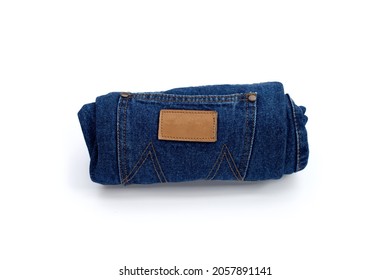 Rolled blue jeans on white background - Powered by Shutterstock