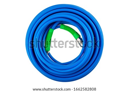 Rolled the blue wire with the green plug on a white background