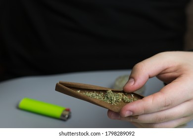 Rolled Blunt With Cannabis In Man Hand With Copy Space