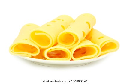 Rolled Cheese Slices On White Plate Isolated On White Background