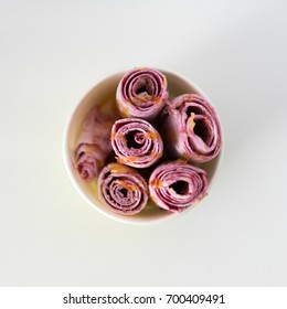 Rolled fruit ice cream isolated. Closeup top view