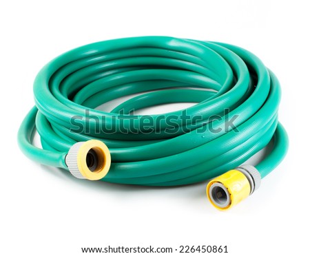 Rolled garden hose isolated on white