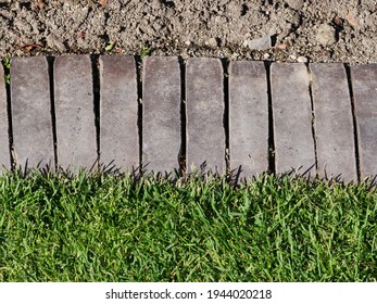 Rolled Layer Made Of Clinker As A Demarcation To The Flowerbed 