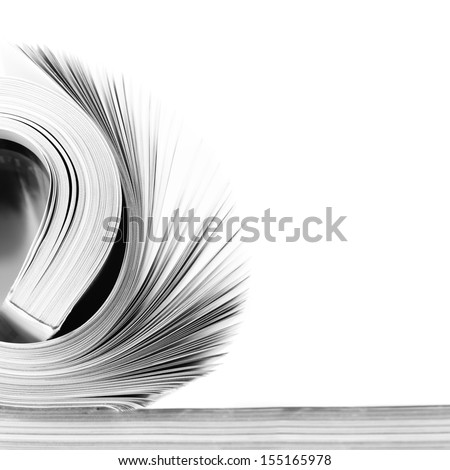Rolled magazine on white background. B&W image.