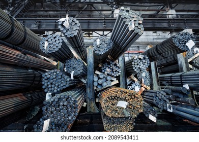 Rolled metal warehouse. Many packs of metal bars on the shelves - Shutterstock ID 2089543411