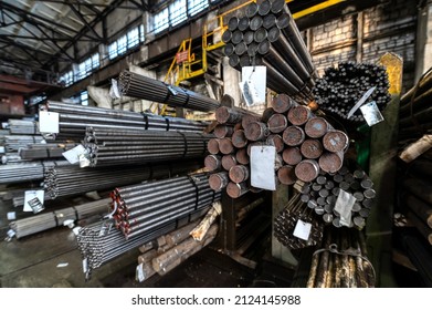 Rolled Metal Warehouse. Many Packs Of Metal Bars On The Shelves