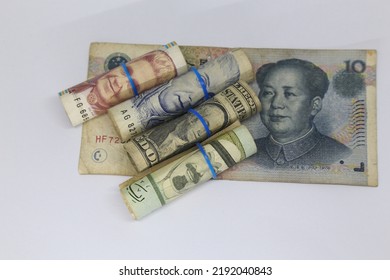 Rolled  Multi Currency Banknotes On White Background
