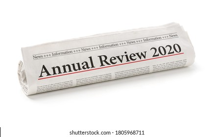 Rolled Newspaper With The Headline Annual Review 2020