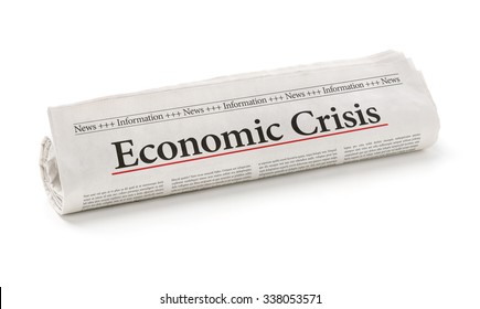 Rolled Newspaper With The Headline Economic Crisis