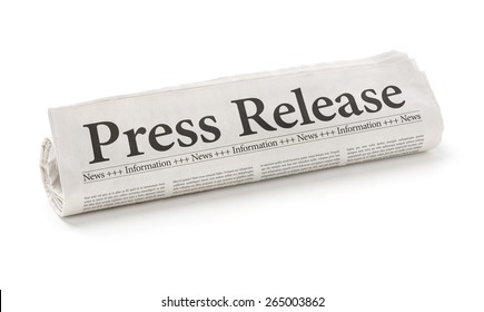 Rolled newspaper with the headline Press Release - Shutterstock ID 265003862