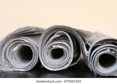 rolled newspapers