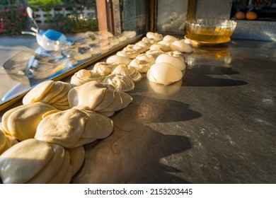 Rolled Roti Dough Prepared Into Strips And Fried.