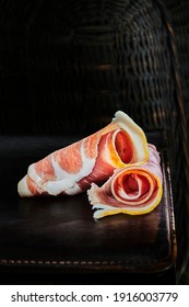 Rolled Slice Of Ham On Metal Table