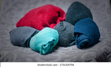 Rolled socks on grey textil background