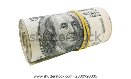 Rolled stack of one hundred dollar bills secured with a yellow rubber band