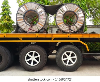 Rolled Steel Coil On The Truck, Fixed By Chain. Transportation Material To The Steel Service Center And The Customers