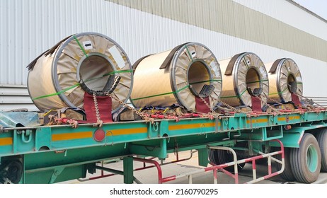 Rolled Steel Coil On The Truck, Fixed By Chain. Transportation Material To The Steel Service Center And The Customers