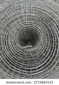 Rolled wire mesh circular pattern abstract.
