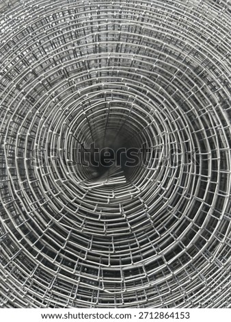 Rolled wire mesh circular pattern abstract.