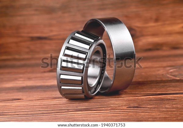 roller bearing on a wooden\
natural background, blank for creativity close-up selective\
focus