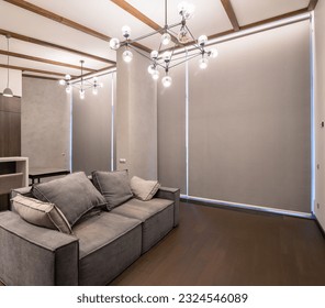 Roller blinds in the interior. Automatic blackout shades on the full height windows. Modern interior with glass wall. Pastel-colored interior. Electric curtains for smart home.  - Shutterstock ID 2324546089