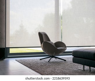 Roller blinds of large sizes on the window in the interior. Automatic solar shades, fabric with linen texture. In front of a large window is a chair on a carpet. Outside is a view of the garden. - Shutterstock ID 2218639593